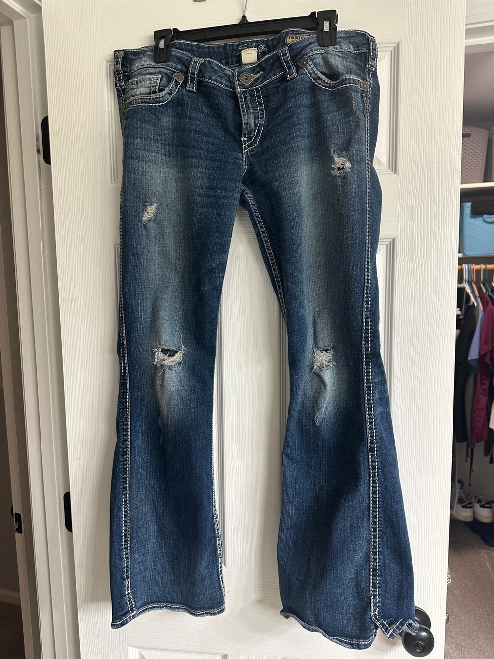 Silver Jeans Women's Distressed Flare in Dark Blue Wash